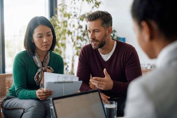 Out-of-state estate administrator discussing inherited property sale with Realtor